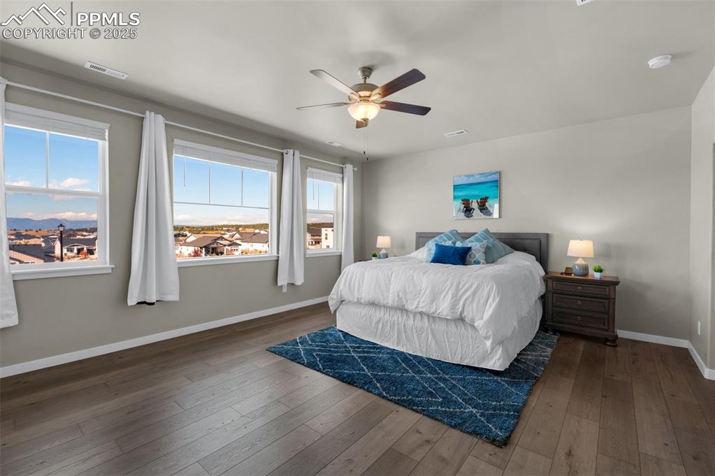 9755 Owl Perch Loop Colorado Springs, CO 80908 - Photo 21 of 50 a bedroom with a large bed and a window