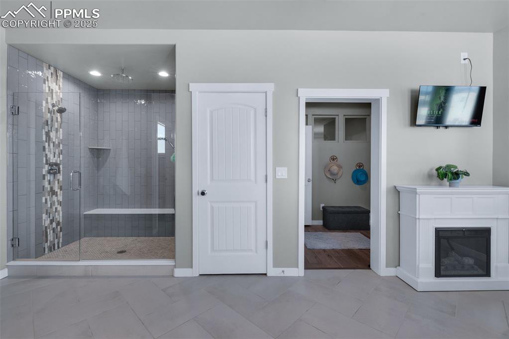 9755 Owl Perch Loop Colorado Springs, CO 80908 - Photo 25 of 50 a view of livingroom with furniture and fireplace