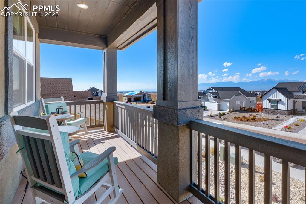 9755 Owl Perch Loop Colorado Springs, CO 80908 - Photo 27 of 50 a view of a balcony dining table and chairs