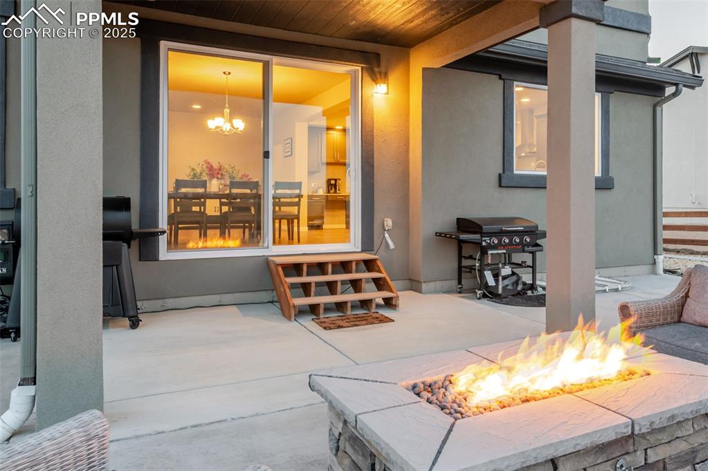 9755 Owl Perch Loop Colorado Springs, CO 80908 - Photo 44 of 50 a bedroom with furniture and a large window