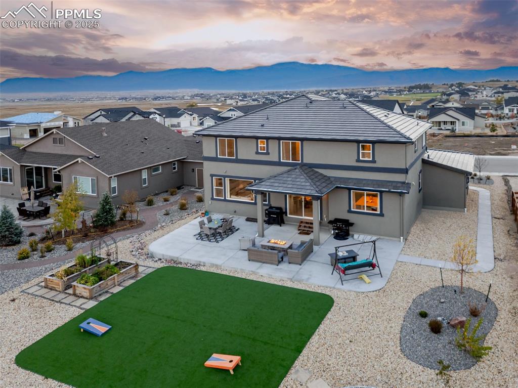 9755 Owl Perch Loop Colorado Springs, CO 80908 - Photo 47 of 50 an aerial view of a house with swimming pool and patio