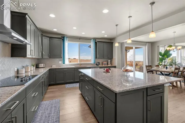 a large kitchen with granite countertop lots of counter top space