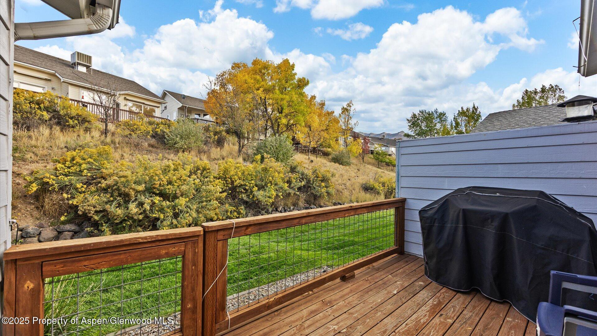 9 West Ridge Court, Unit 1113 Parachute, CO 81635 - Photo 22 of 27 a view of a wooden door and a yard