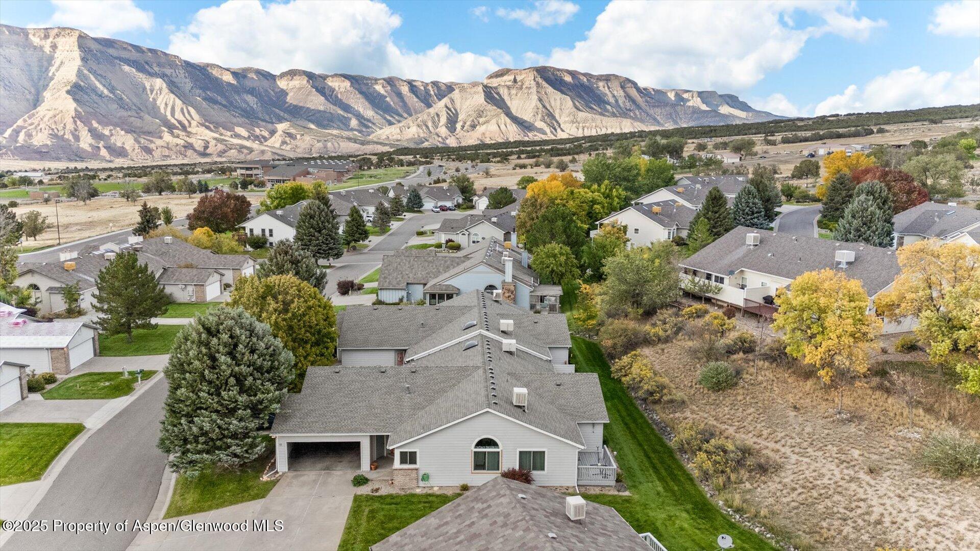 9 West Ridge Court, Unit 1113 Parachute, CO 81635 - Photo 26 of 27 a aerial view of a house with a yard and potted plants