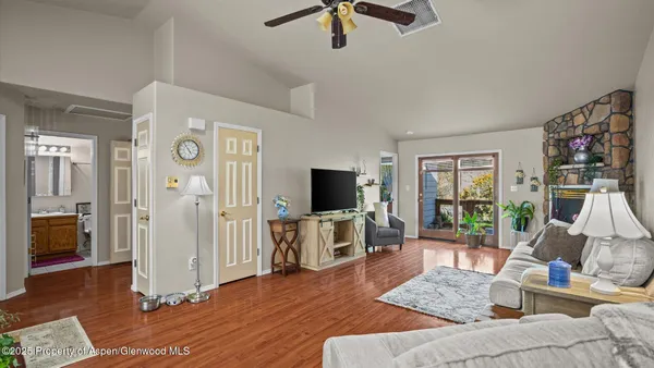 a view of kitchen with kitchen island stainless steel appliances granite countertop cabinets and a counter top space