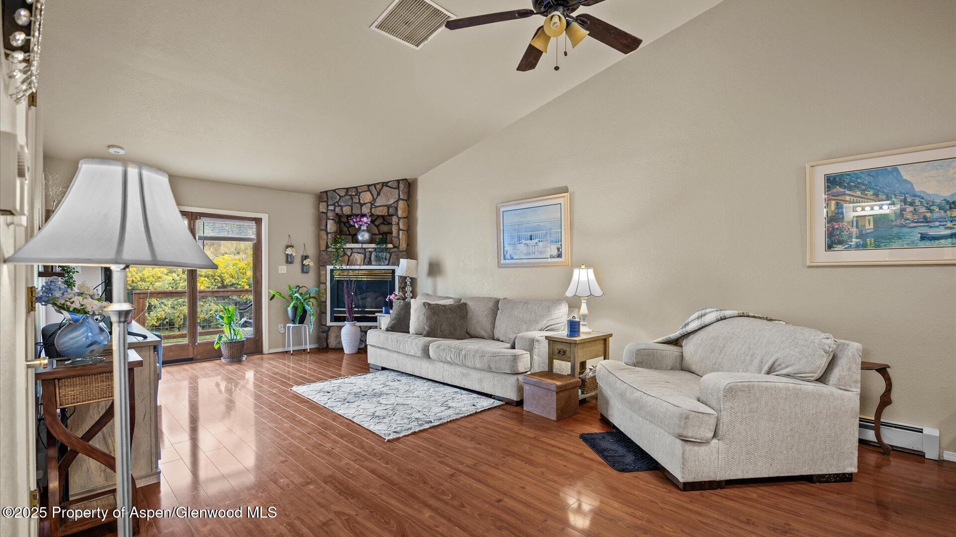 9 West Ridge Court, Unit 1113 Parachute, CO 81635 - Photo 6 of 27 a living room with furniture and a wooden floor