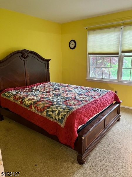 7 Rymon Road Washington, NJ 07882 - Photo 13 of 15 a bedroom with a bed and a window