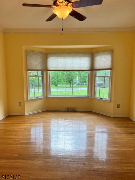 7 Rymon Road Washington, NJ 07882 - Photo 6 of 15 a view of an empty room with wooden floor and a window