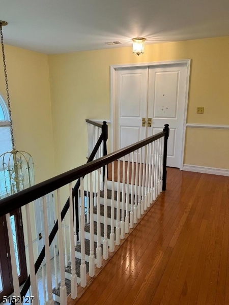 7 Rymon Road Washington, NJ 07882 - Photo 10 of 15 a view of a hallway with wooden floor and stairs