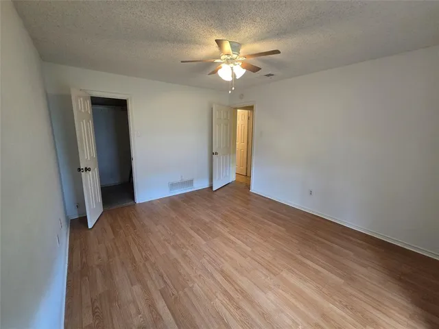 a view of a livingroom with a chandelier fan