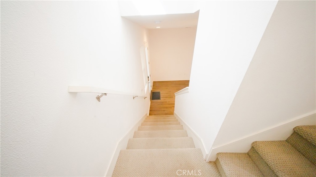 320 Bridgewater Way, Unit 7 Gardena, CA 90247 - Photo 11 of 41 a view of a hallway with furniture and wooden floor