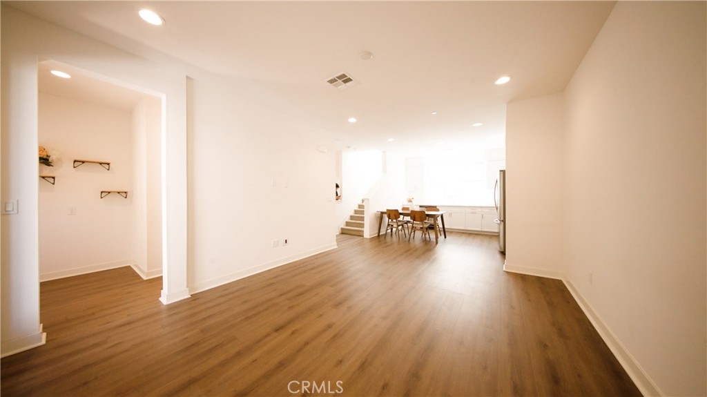 320 Bridgewater Way, Unit 7 Gardena, CA 90247 - Photo 17 of 41 a view of empty room with wooden floor