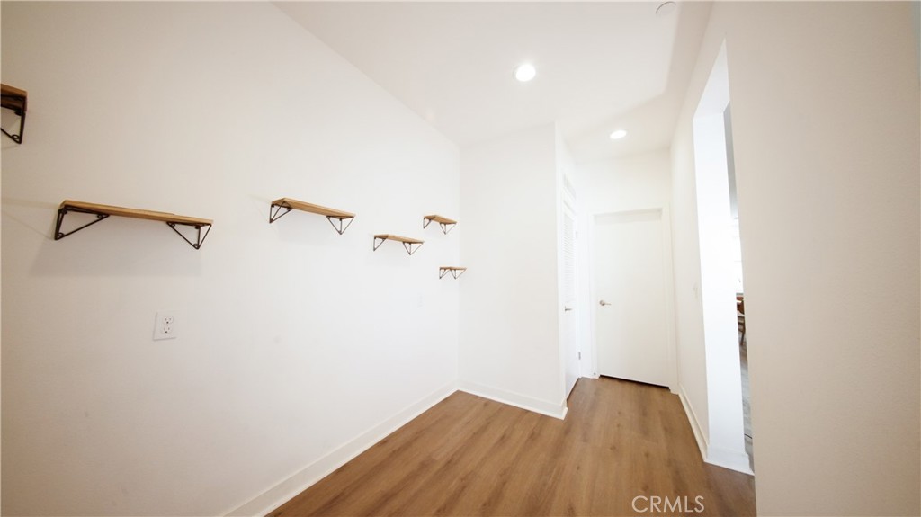 320 Bridgewater Way, Unit 7 Gardena, CA 90247 - Photo 23 of 41 a view of small space with racks on the wall