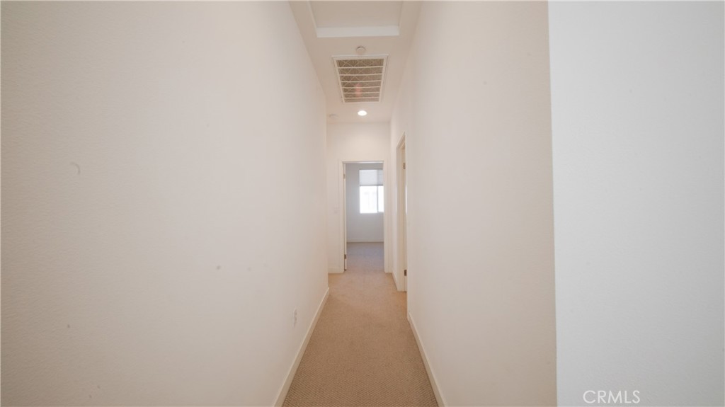 320 Bridgewater Way, Unit 7 Gardena, CA 90247 - Photo 27 of 41 a view of a hallway with wooden floor