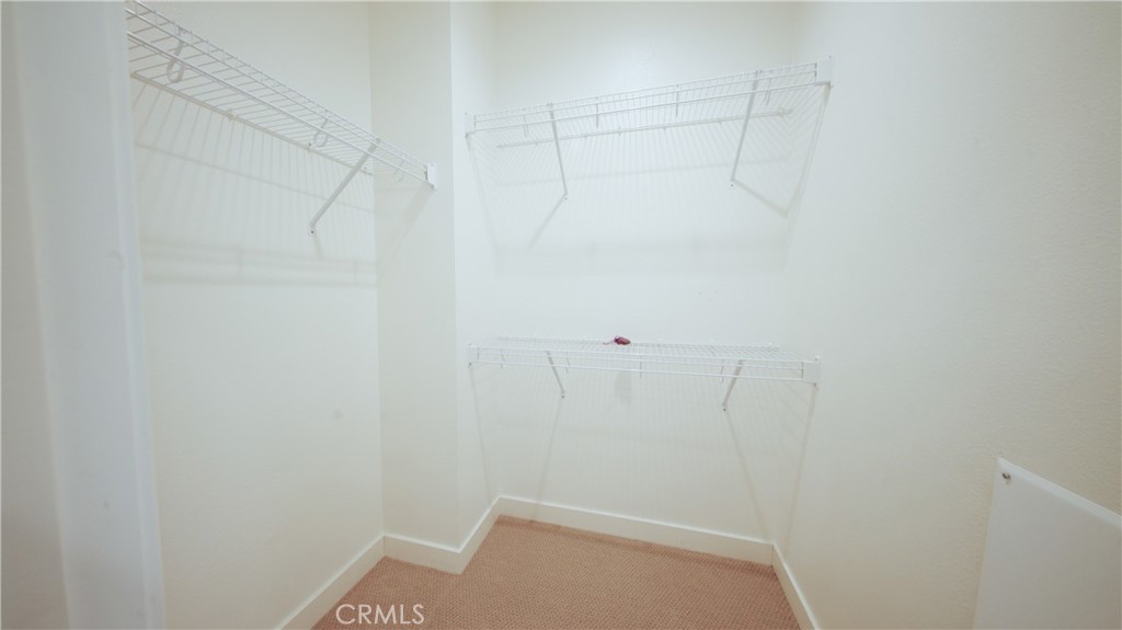 320 Bridgewater Way, Unit 7 Gardena, CA 90247 - Photo 32 of 41 a view of a room with racks on the wall