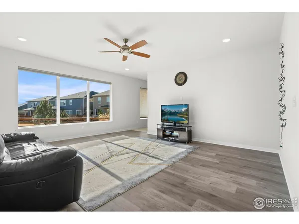 a living room with a bed furniture and a window