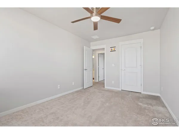 a bathroom with a double vanity sink mirror and toilet