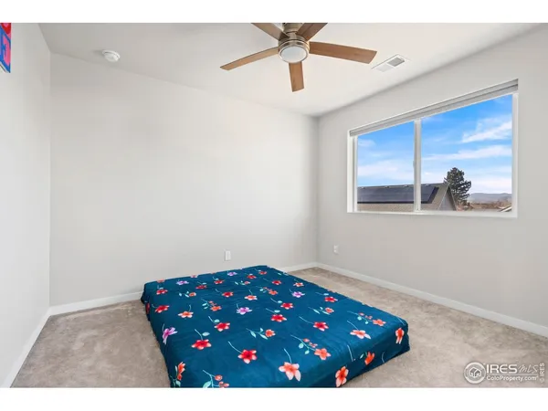 a view of room with wooden floor and cabinet