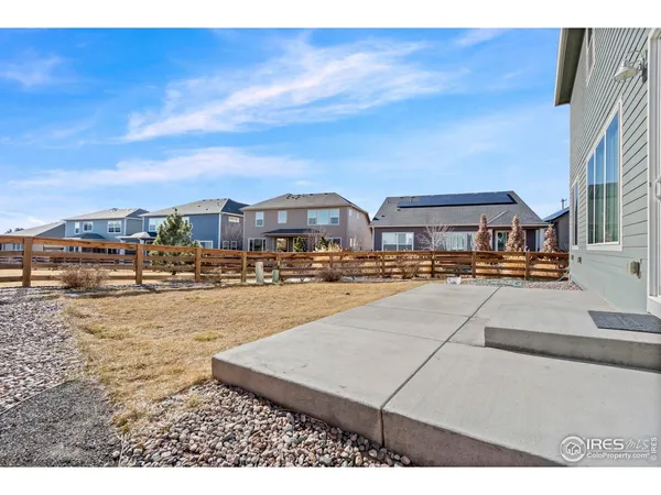 a view of empty room with wooden walls