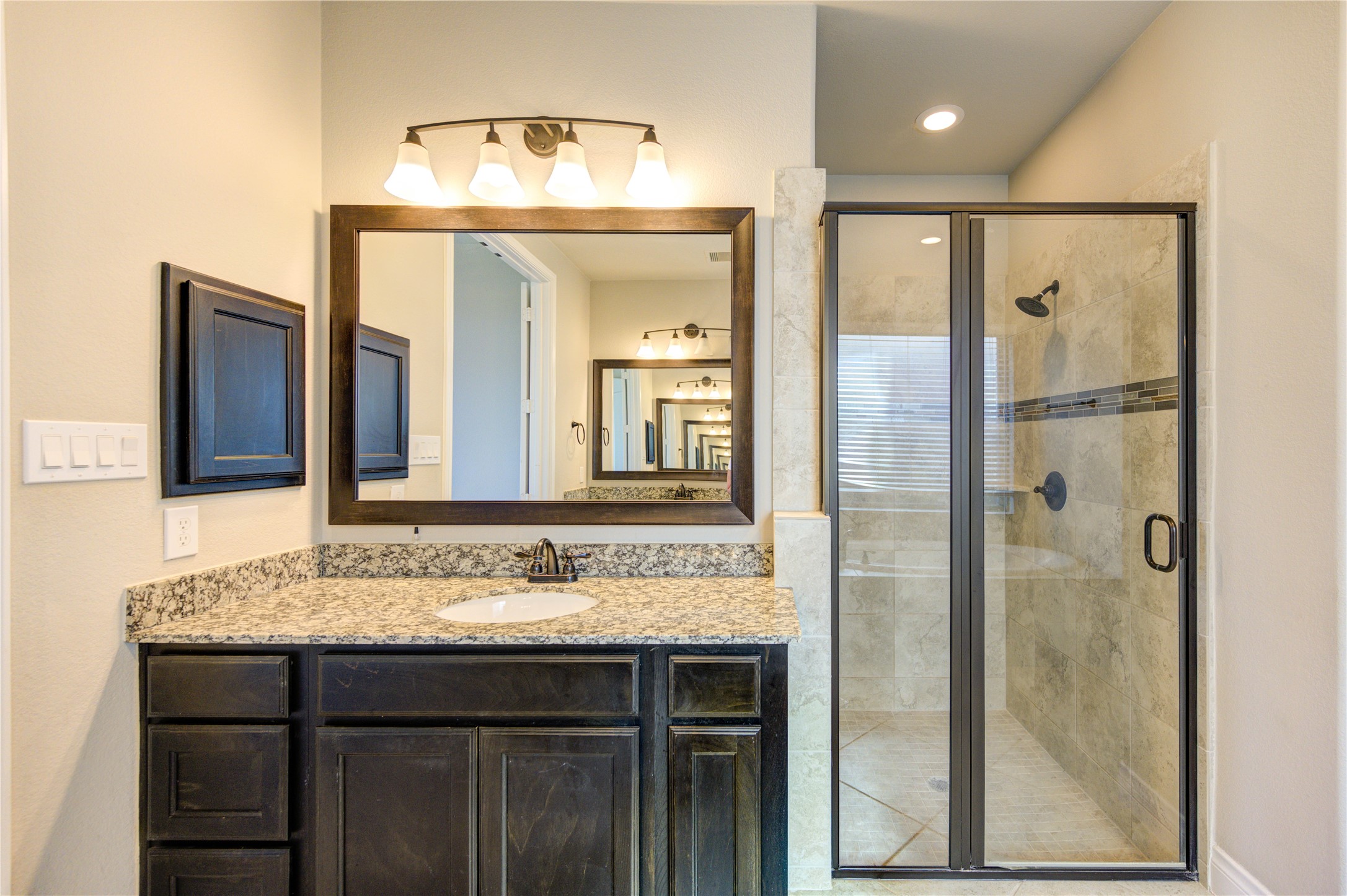 4207 Abigail Way Sugar Land, TX 77479 - Photo 27 of 48 a bathroom with a granite countertop sink and a mirror
