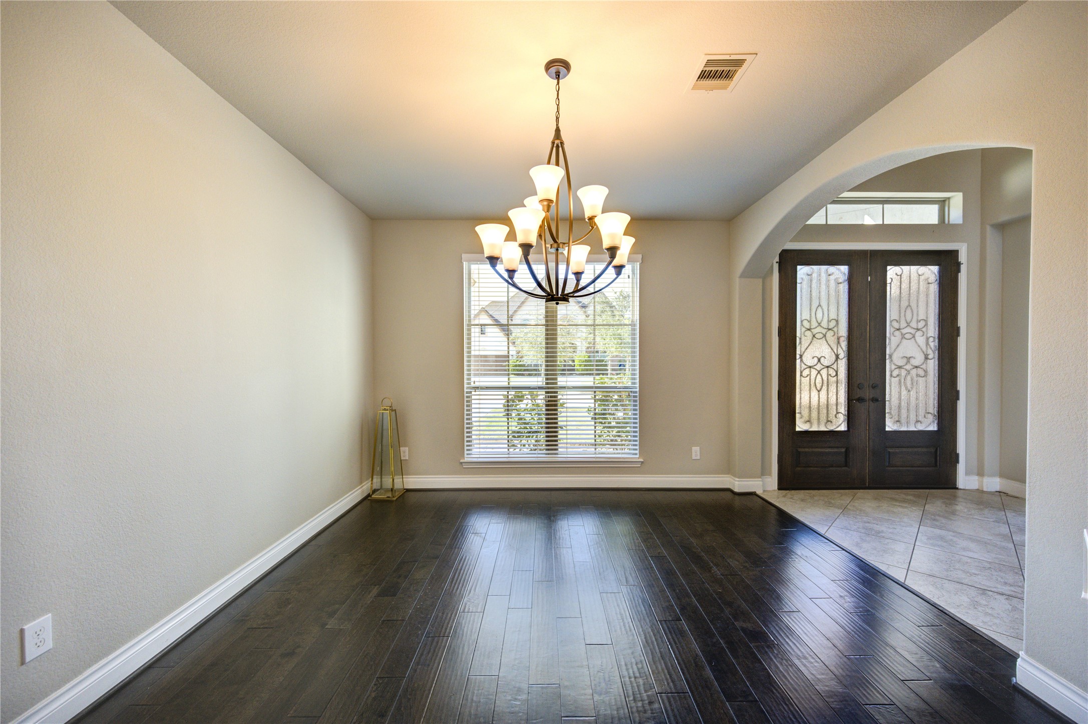 4207 Abigail Way Sugar Land, TX 77479 - Photo 10 of 48 a view of an empty room with wooden floor and a window