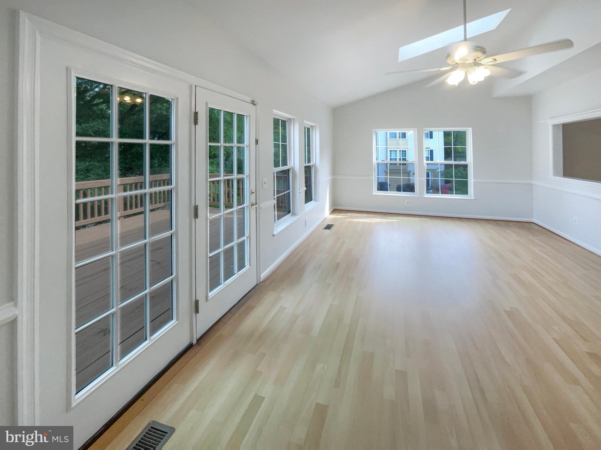 14272 Glade Spring Drive Centreville, VA 20121 - Photo 13 of 46 a view of an empty room with a window and wooden floor