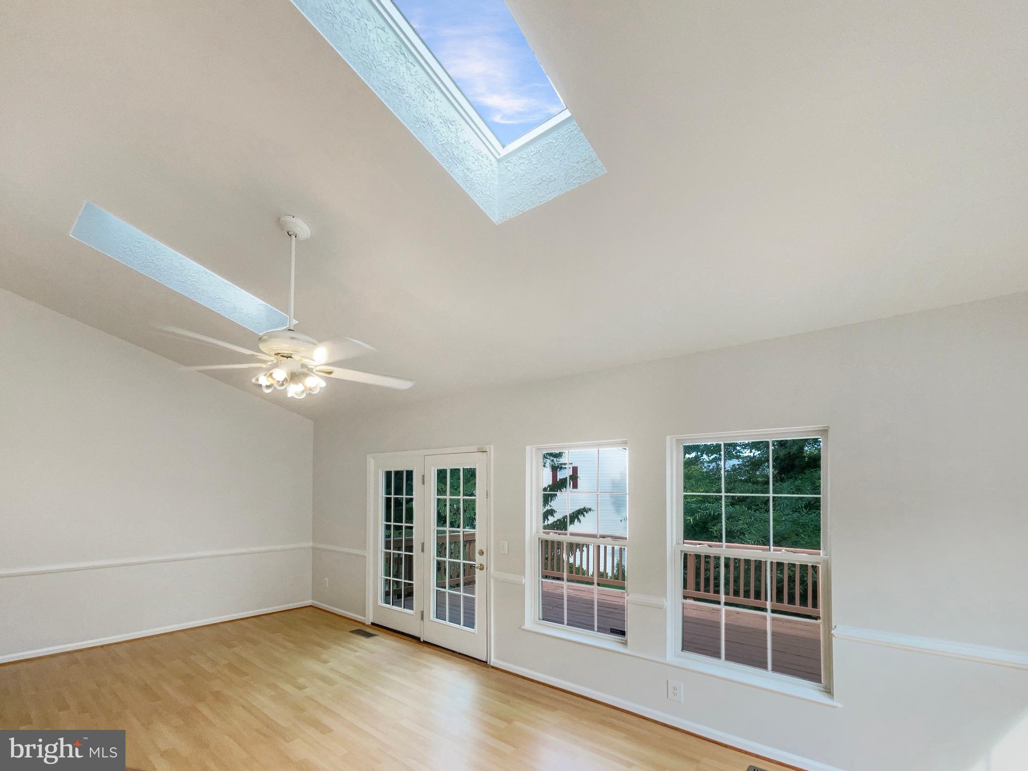 14272 Glade Spring Drive Centreville, VA 20121 - Photo 15 of 46 a view of an empty room with a window and wooden floor