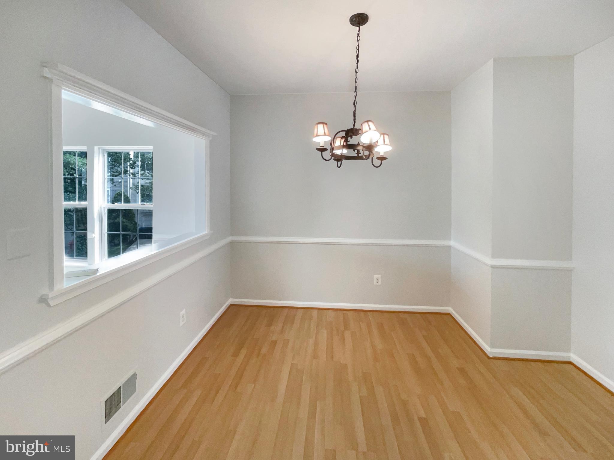 14272 Glade Spring Drive Centreville, VA 20121 - Photo 16 of 46 a view of empty room with wooden floor and fan