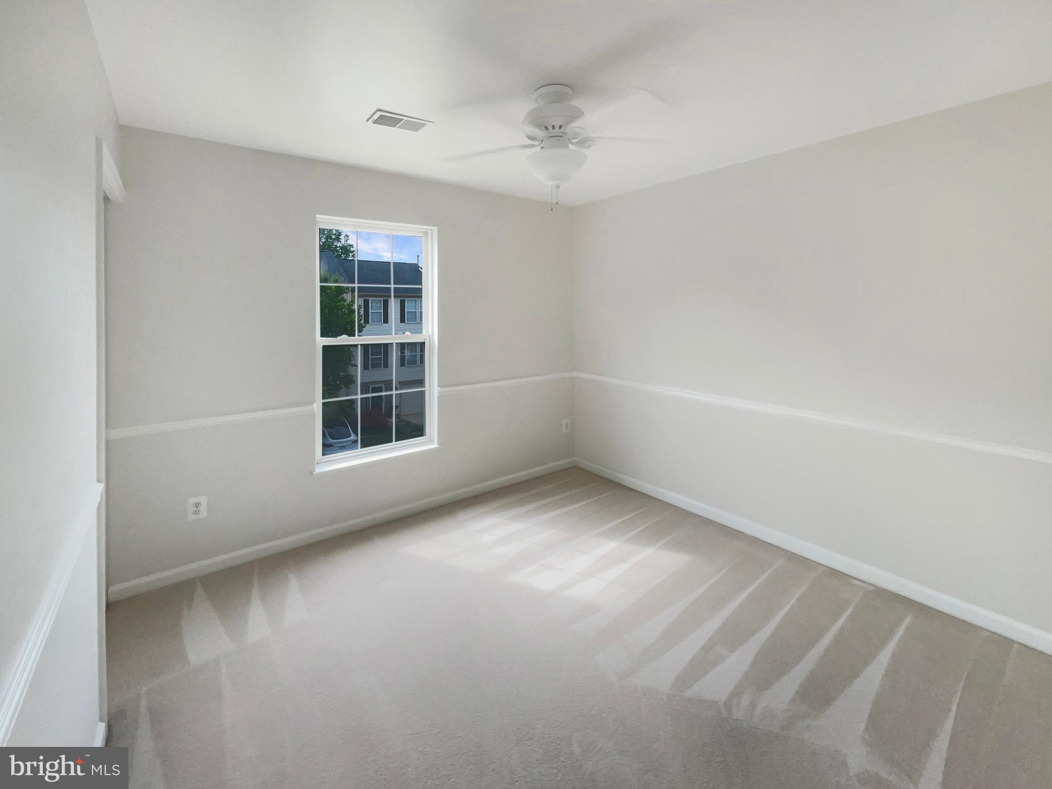 14272 Glade Spring Drive Centreville, VA 20121 - Photo 26 of 46 a view of an empty room with a window