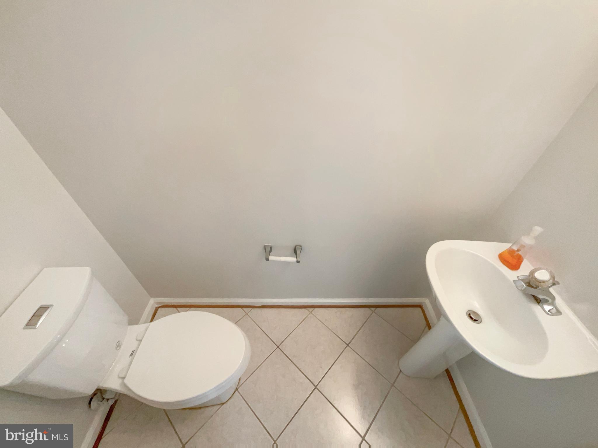 14272 Glade Spring Drive Centreville, VA 20121 - Photo 30 of 46 a bathroom with a toilet and a sink