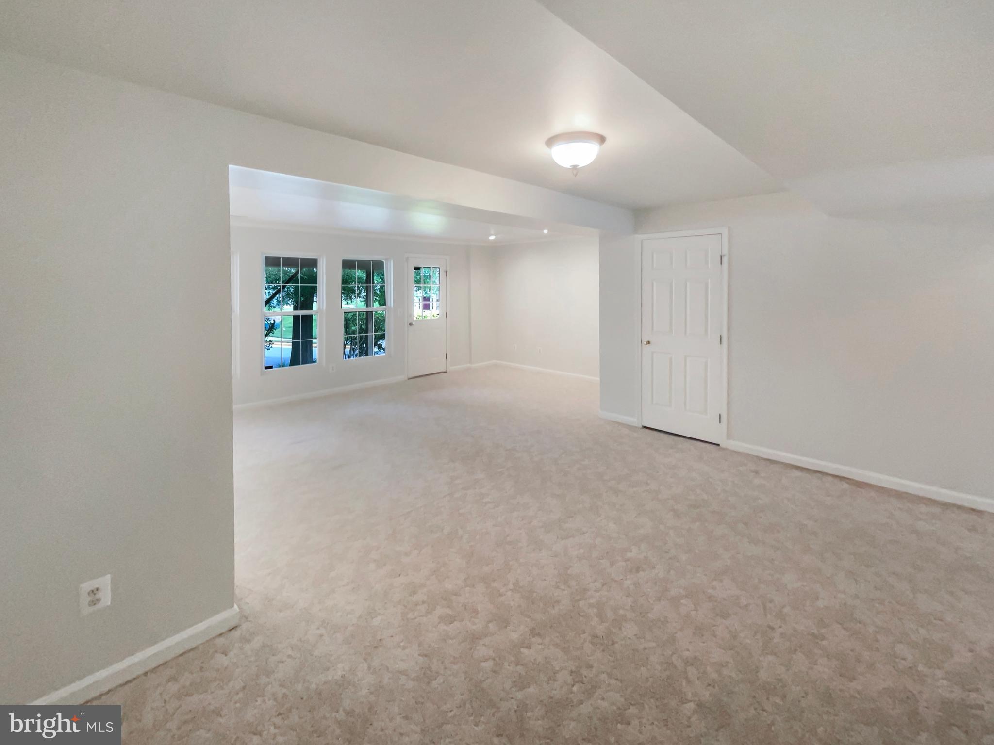 14272 Glade Spring Drive Centreville, VA 20121 - Photo 32 of 46 an empty room with windows and entrance