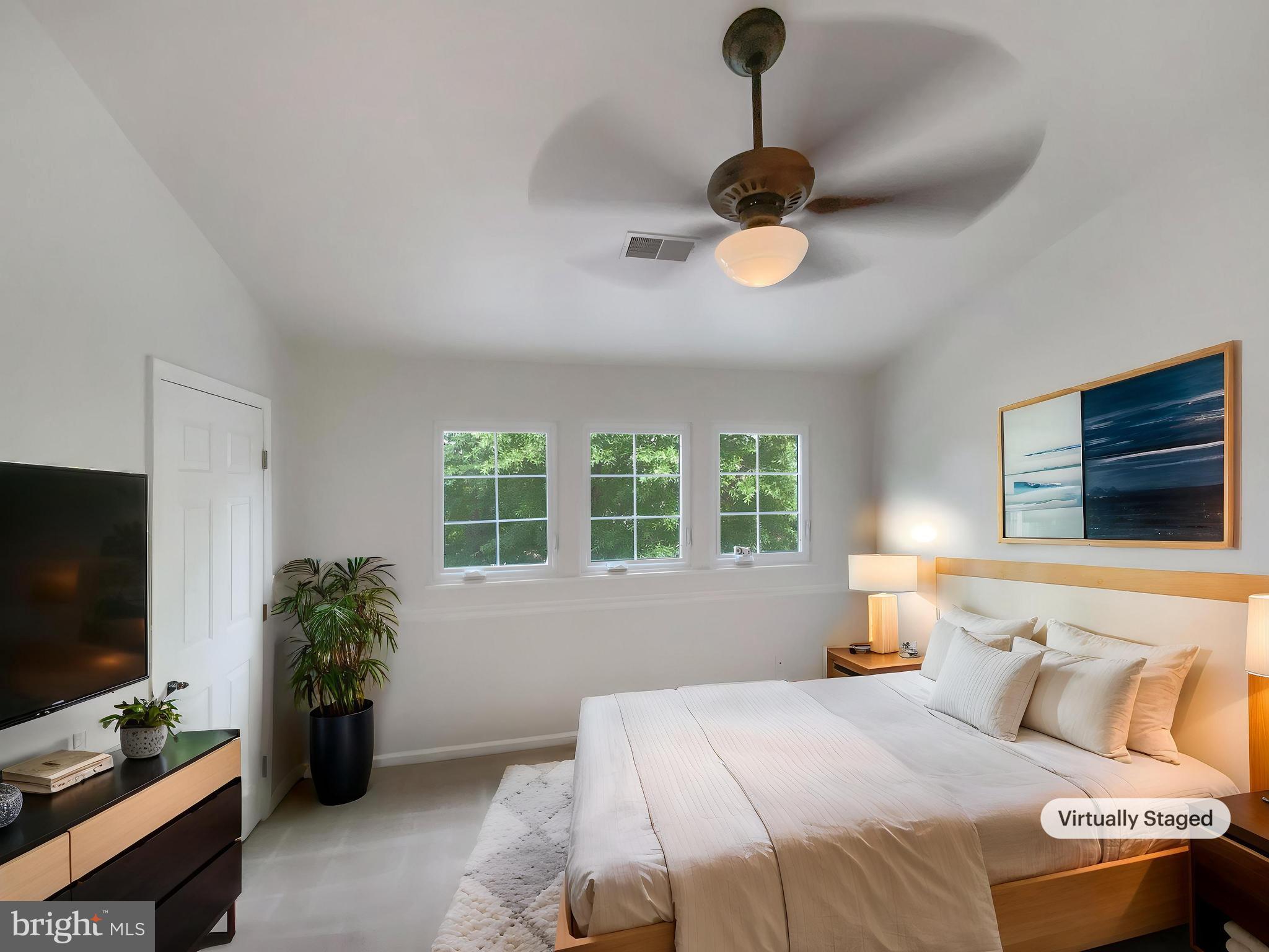 14272 Glade Spring Drive Centreville, VA 20121 - Photo 4 of 46 a bedroom with a bed and a flat screen tv