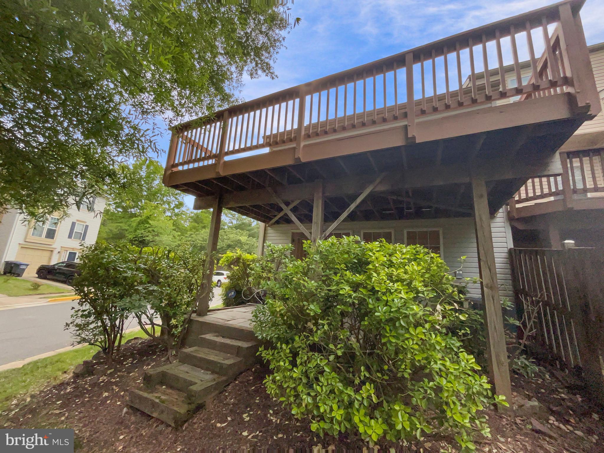 14272 Glade Spring Drive Centreville, VA 20121 - Photo 8 of 46 a view of a porch with a bench