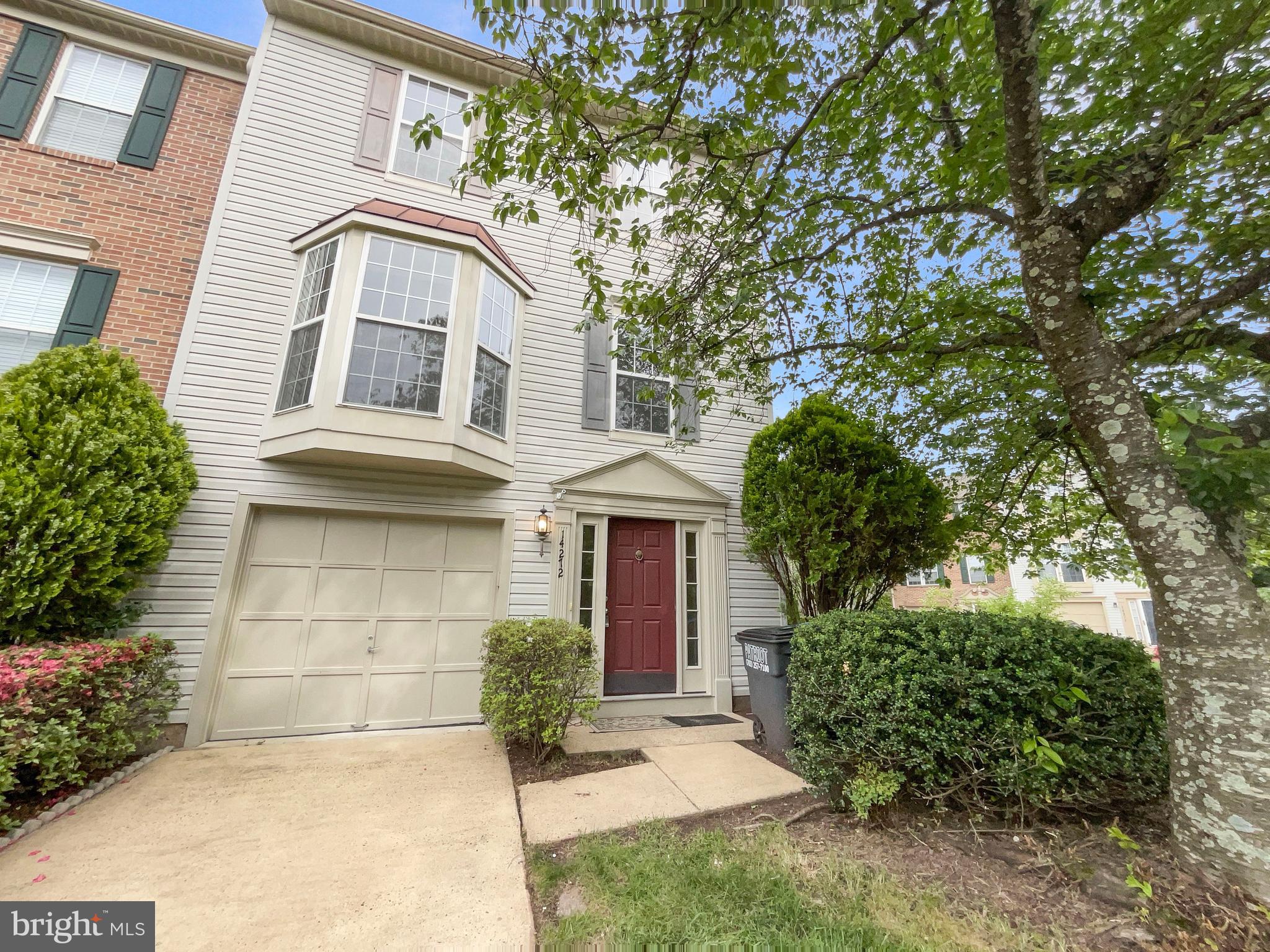 14272 Glade Spring Drive Centreville, VA 20121 - Photo 9 of 46 a front view of a house with a garden