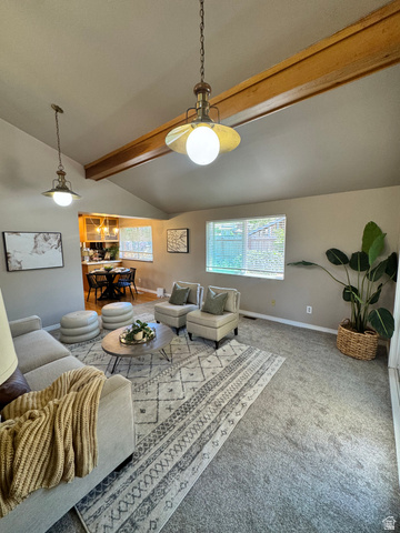 4245 3320 East Holladay, UT 84124 - Photo 13 of 51 Vaulted ceilings with exposed wood beams define this living area, featuring recessed windows, neutral wall tones, and carpet flooring