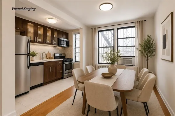 a view of a dining room with furniture and window