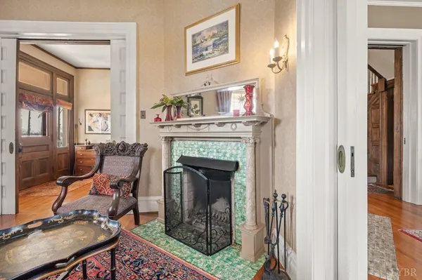 a living room with furniture and a floor to ceiling window