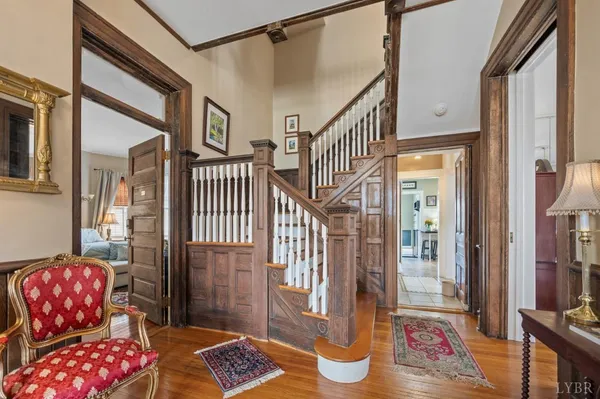 a front view of a house with yard and green space