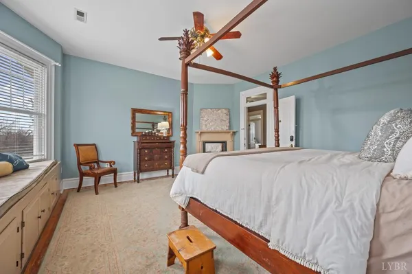 an aerial view of a house with a yard basket ball court and outdoor seating