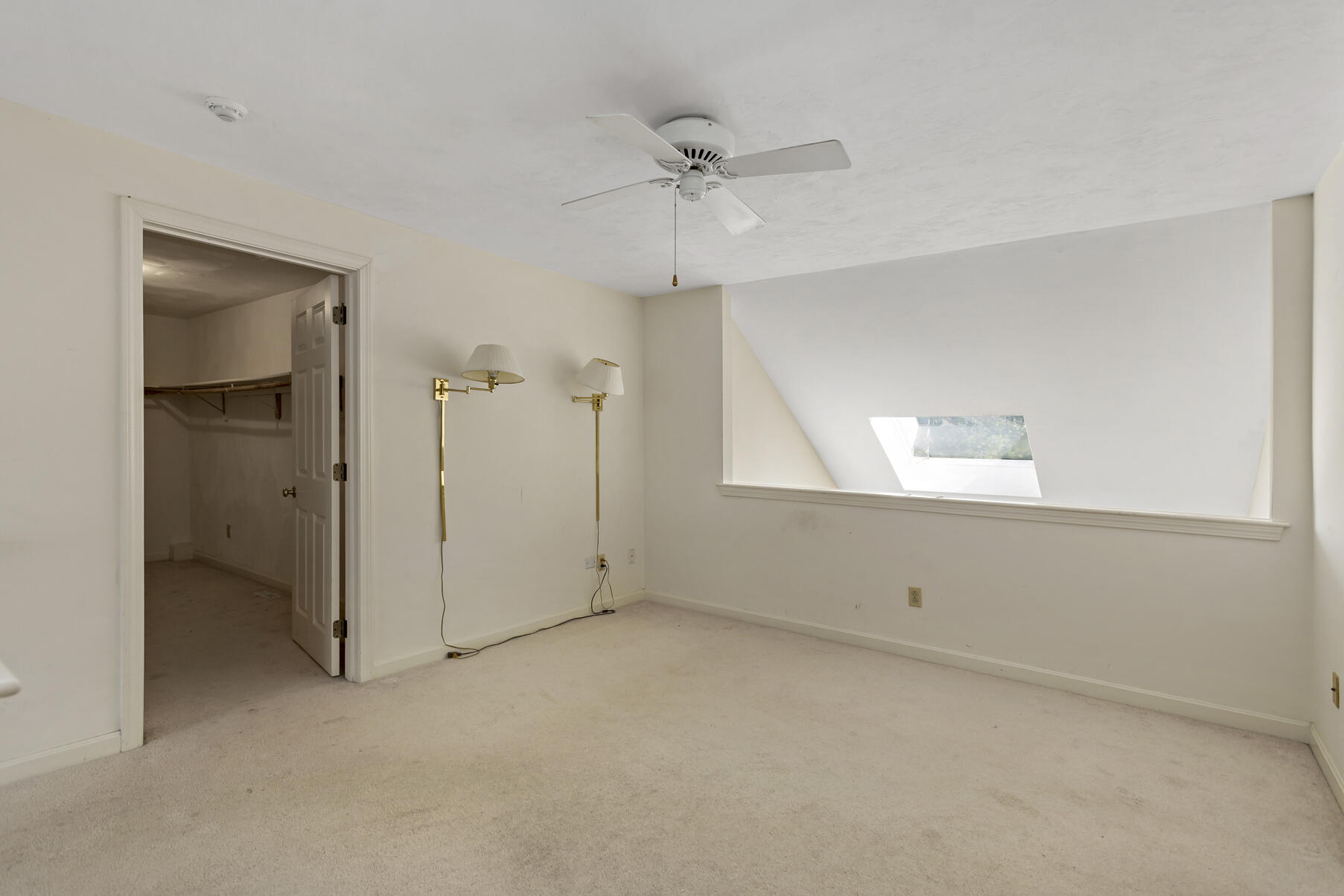 3 Kettle Lane Mashpee, MA 02649 - Photo 15 of 25 an empty room with a ceiling fan and a window