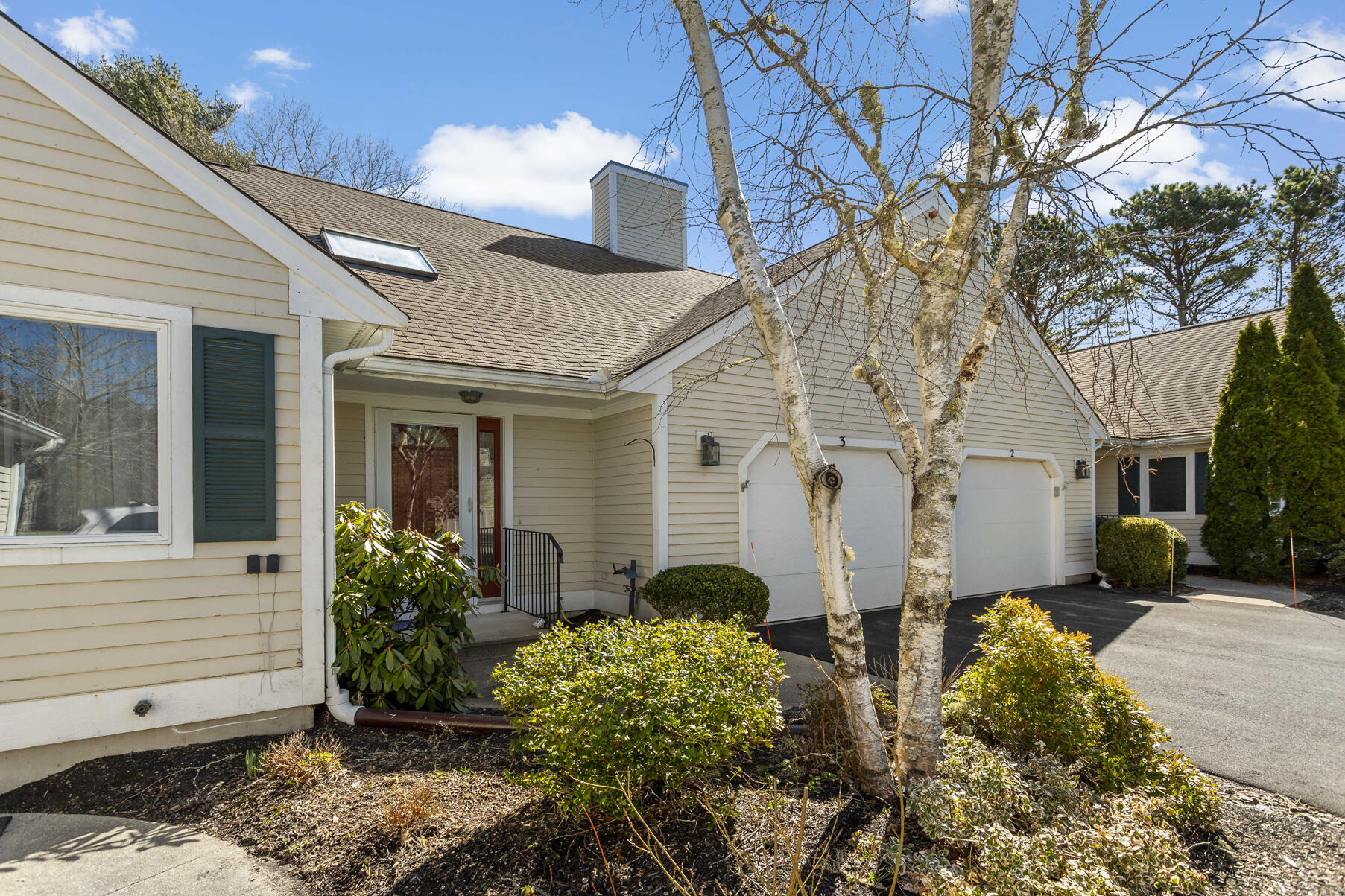 3 Kettle Lane Mashpee, MA 02649 - Photo 2 of 25 a view of a white house with a flower garden