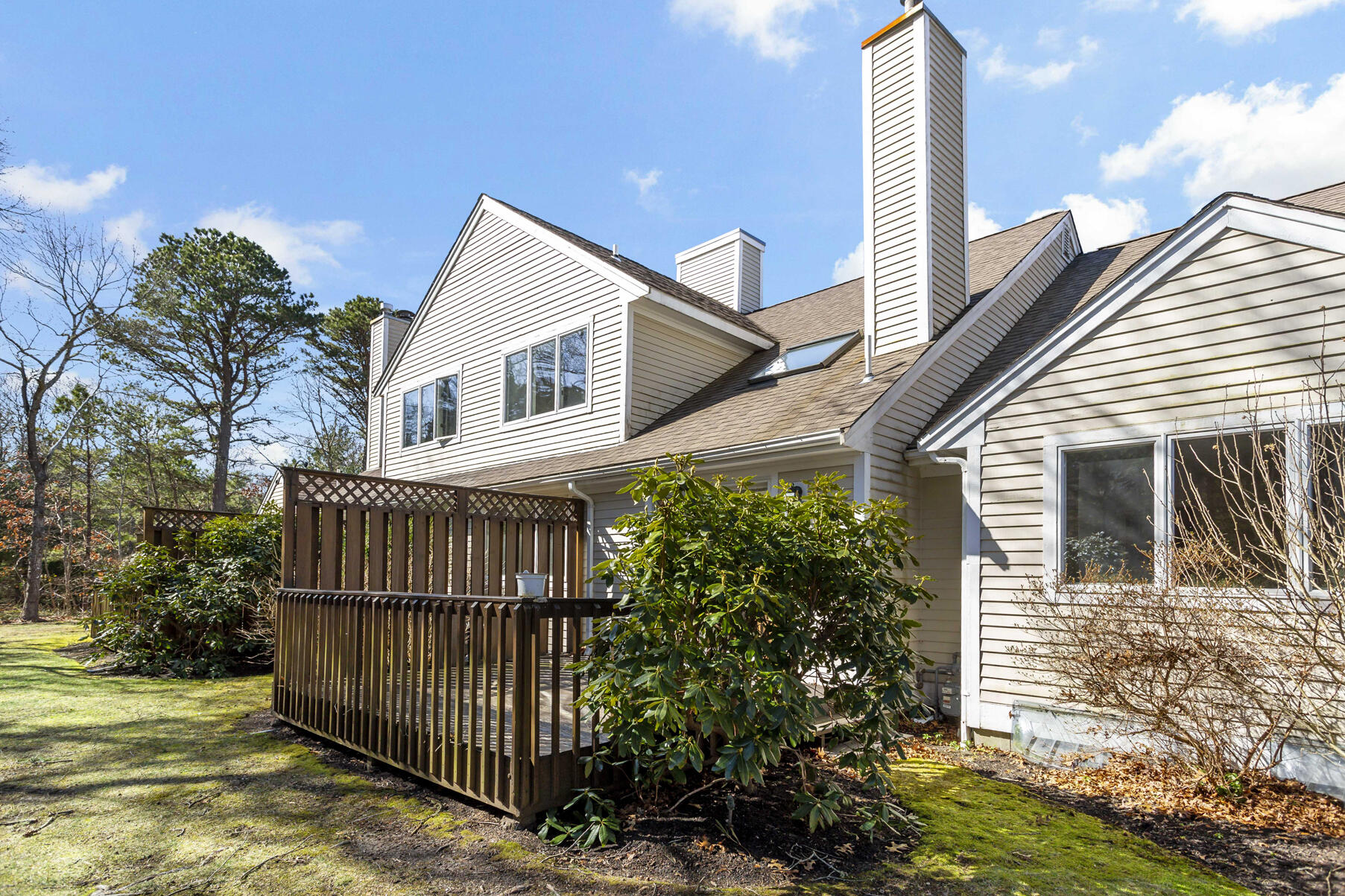 3 Kettle Lane Mashpee, MA 02649 - Photo 21 of 25 a view of a house with a small yard and plants