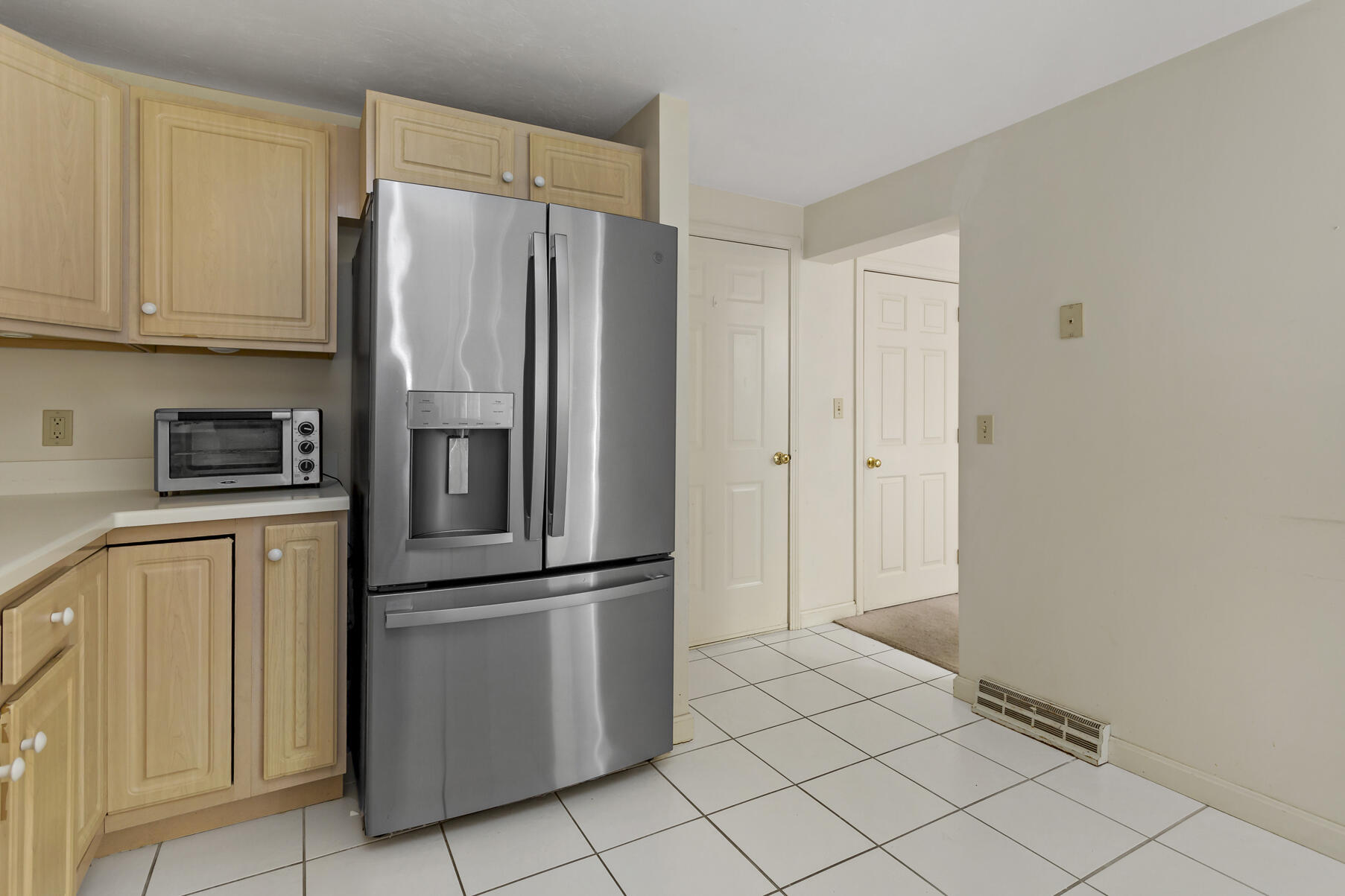 3 Kettle Lane Mashpee, MA 02649 - Photo 7 of 25 a kitchen with stainless steel appliances a refrigerator and cabinets