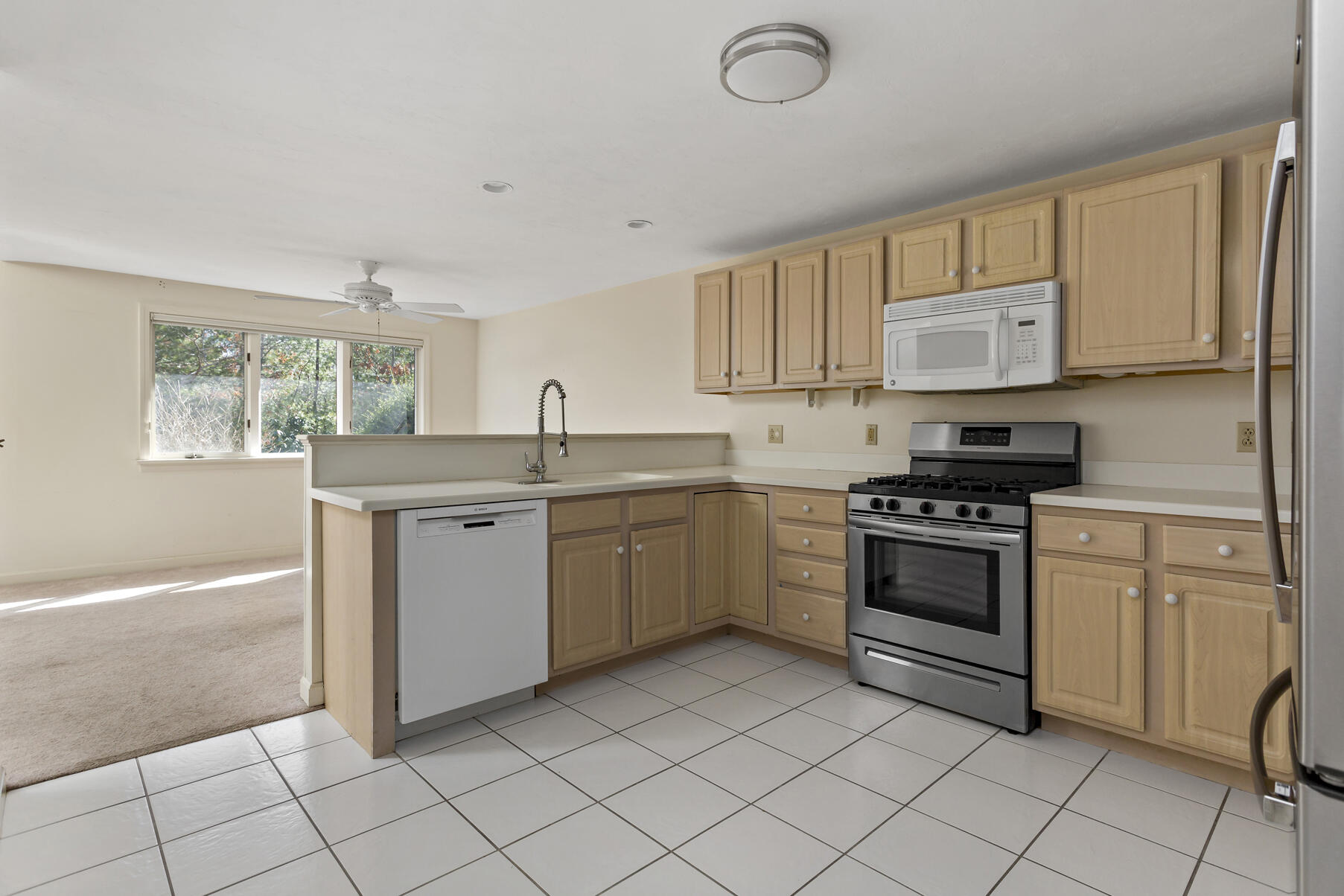3 Kettle Lane Mashpee, MA 02649 - Photo 8 of 25 a kitchen with a stove sink and cabinets