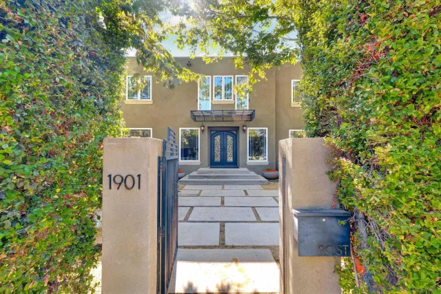a view of house with a tree in front