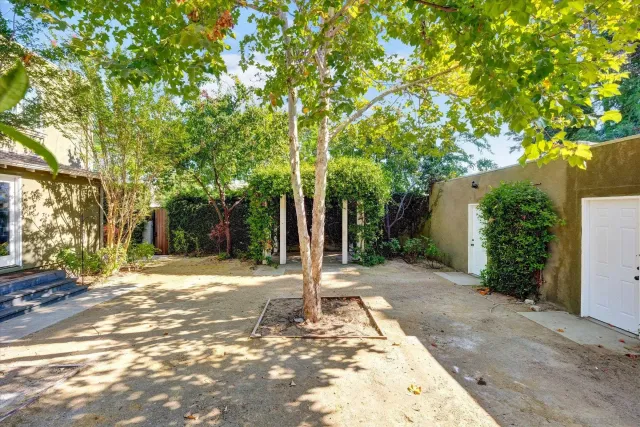 a wooden bench sitting in front of a building