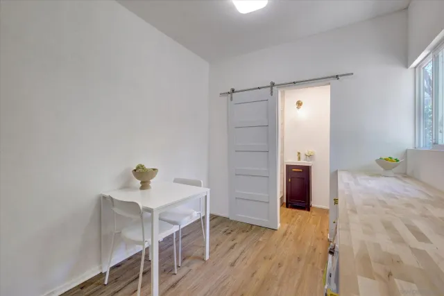 a view of hallway with wooden floor