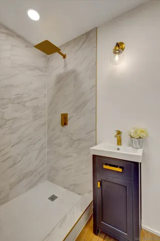 a bathroom with a sink and a shower