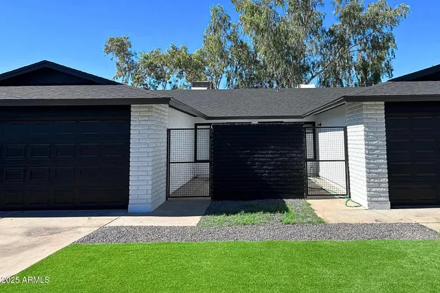 a view of a house with a small yard