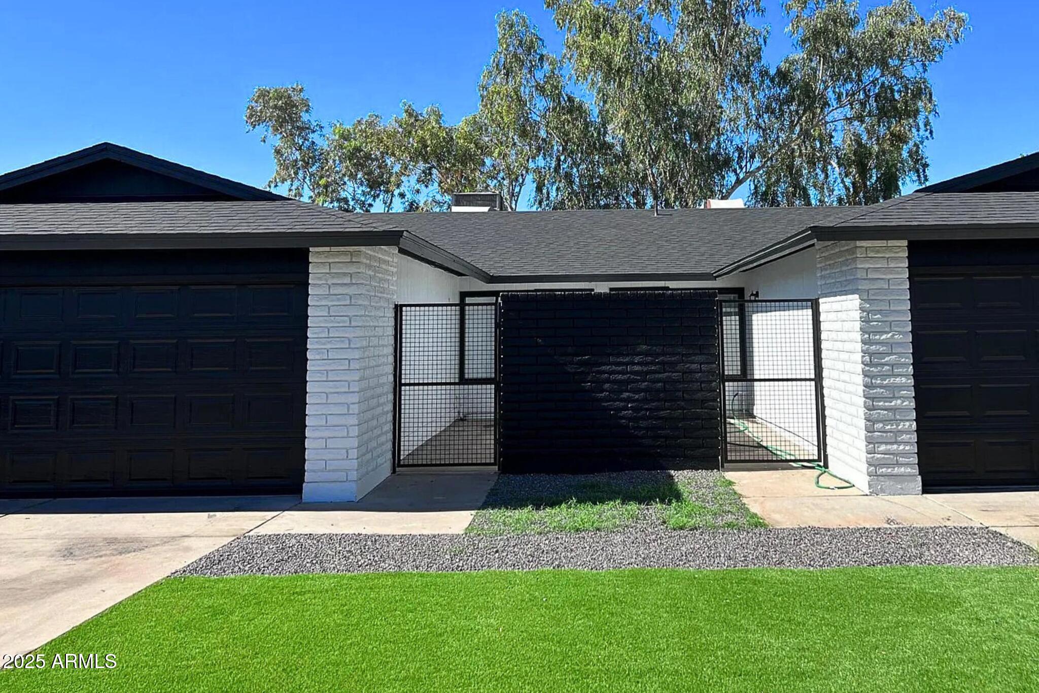 a view of a house with a small yard